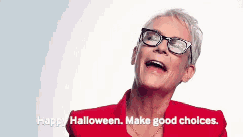 a woman wearing glasses and a red jacket is laughing and saying `` happy halloween . make good choices . ''