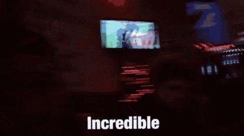 a man wearing sunglasses says incredible in front of a christmas tree