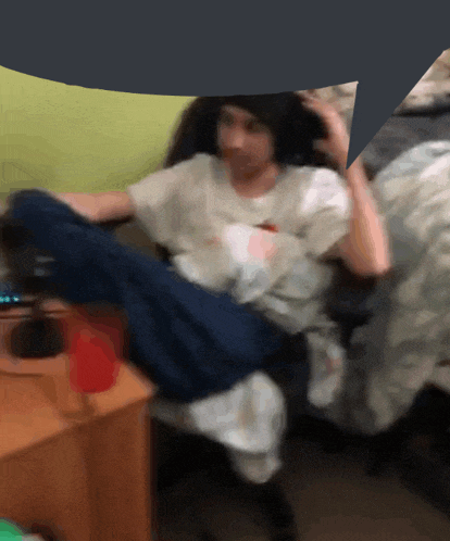a blurry image of a person sitting in a chair