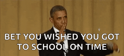 barack obama is wearing a tuxedo and making a funny face while holding his hand to his mouth .