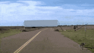 a road with a sign on the right that says ' i 'm sorry '