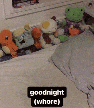 a bunch of stuffed animals laying on a bed with the words goodnight ( whore ) above them