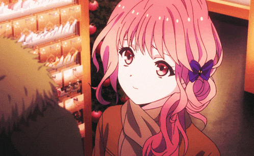 a girl with pink hair and a blue flower in her hair is standing in front of a christmas tree