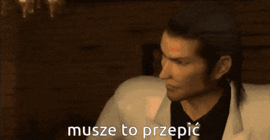 a man in a white suit is talking in a foreign language