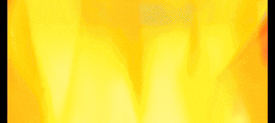 a blurry picture of a fire with a yellow and orange background .
