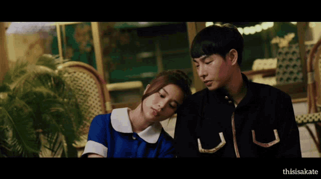 a man and a woman are sitting next to each other and the words thisisakate are on the bottom right