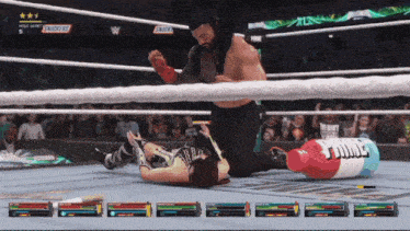 a video game screen shows a wrestling match between roman reigns and shawn michaels