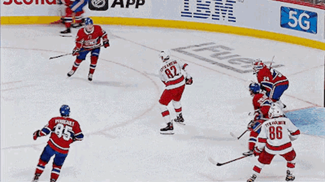 a hockey player with the number 86 on his jersey celebrates his goal