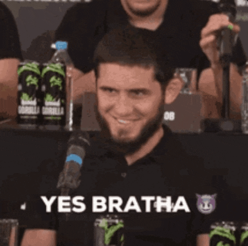 a man in a black shirt says yes bratha