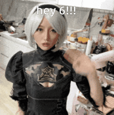 a woman in a cosplay costume is standing in a kitchen and says hey 6 !!!