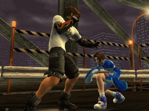 a man wearing a shirt that says ' samurai ' on it is fighting a girl