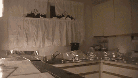 a kitchen with a sink a stove and a window