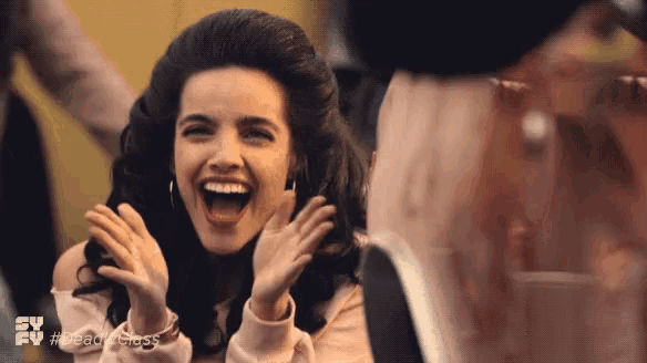 a woman is laughing in a tv ad for readyclass