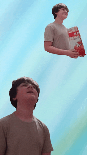 a boy holding a bag of mac n cheese