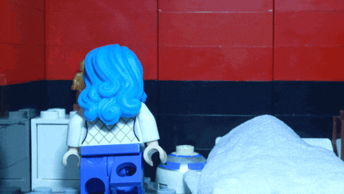a lego figure with blue hair and a white shirt