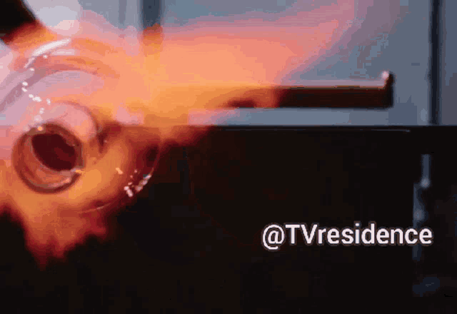 a flame is coming out of a hole in a piece of glass