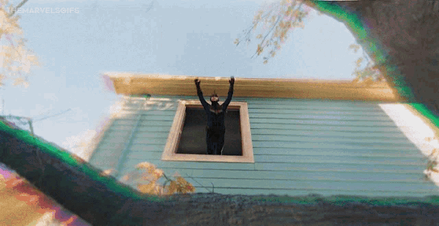 a gif of a person jumping out of a window with the hashtag #marvelsgifs at the bottom
