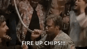 a man is holding a hose in his mouth and saying `` fire up chips ! '' .