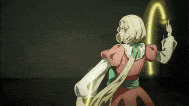 a girl in a pink dress is holding a yellow object in her hand
