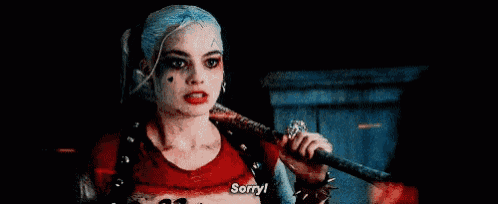 harley quinn from suicide squad is holding a bat and saying `` sorry '' .