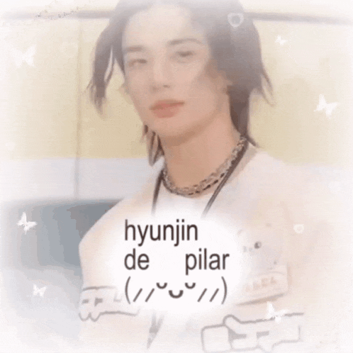 a picture of hyunjin de pilar with his eyes closed and his finger in his mouth