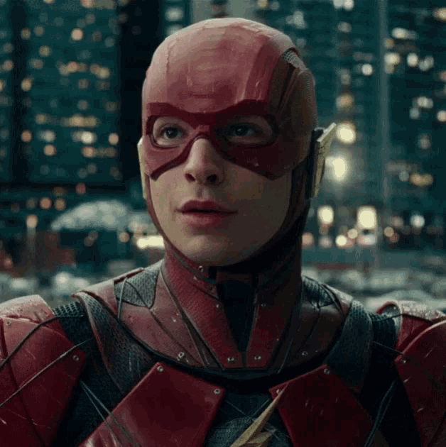 a close up of a man in a red superhero suit
