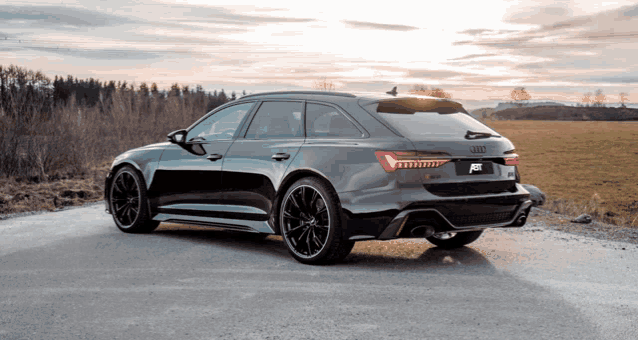 an audi rs6 is parked on the side of the road
