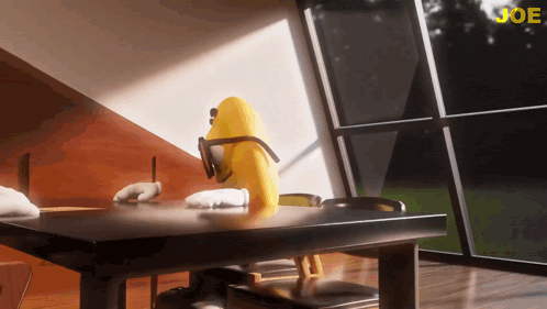 a yellow cartoon character is sitting at a table with the word joe in the corner