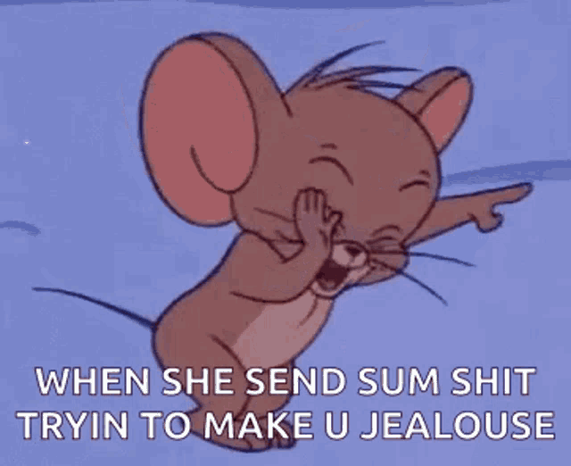 jerry from tom and jerry is laughing and pointing at the camera .