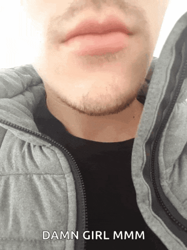 a close up of a man 's face with the words damn girl mmmm on the bottom