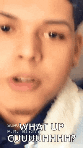 a close up of a man 's face with the words `` what up cuuuhhh '' written on it .