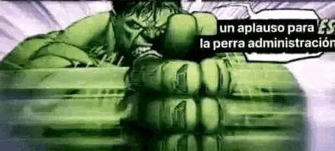 the hulk is holding his fist up in a cartoon .