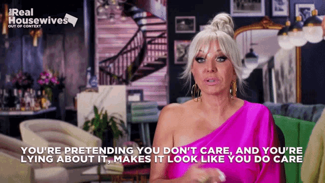a woman in a pink one shoulder dress is talking about lying