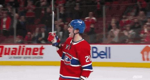 a hockey player wearing a red white and blue jersey with the number 21