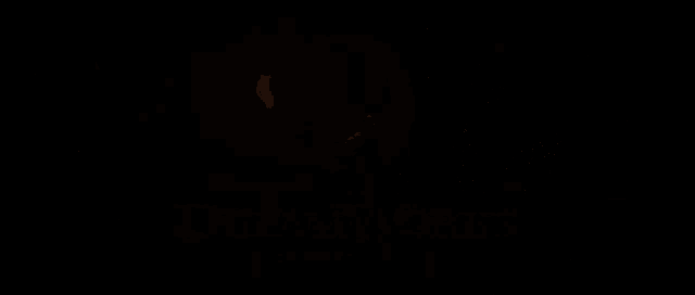 a dreamworks logo with a monkey on the moon