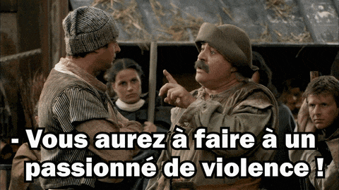 a man with a mustache is pointing at another man in a foreign language