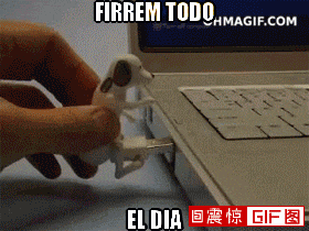 a gif of a person plugging a dog into a laptop with the words firrem todo el dia on the bottom