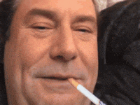 a man is smoking a cigarette with his mouth open