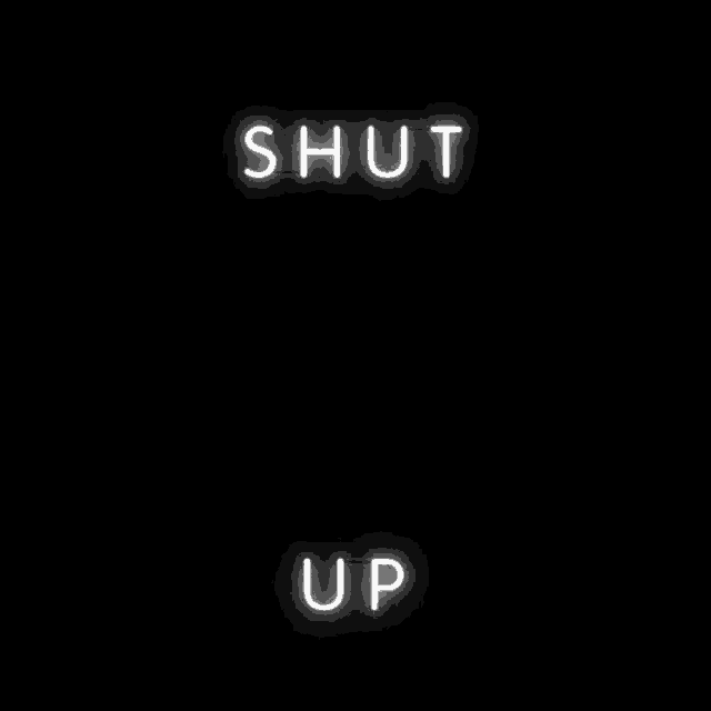 a neon sign that reads `` shut the fuck up '' on a black background .