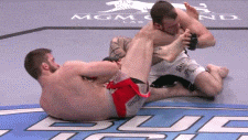two men are wrestling on a mat with mgm las vegas written on it