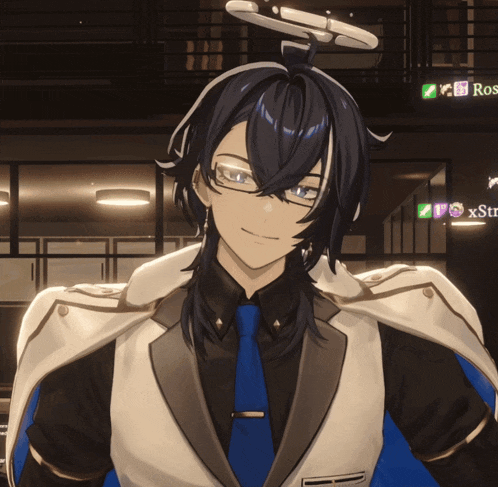 a man in a suit and tie is smiling in front of a sign that says xstre