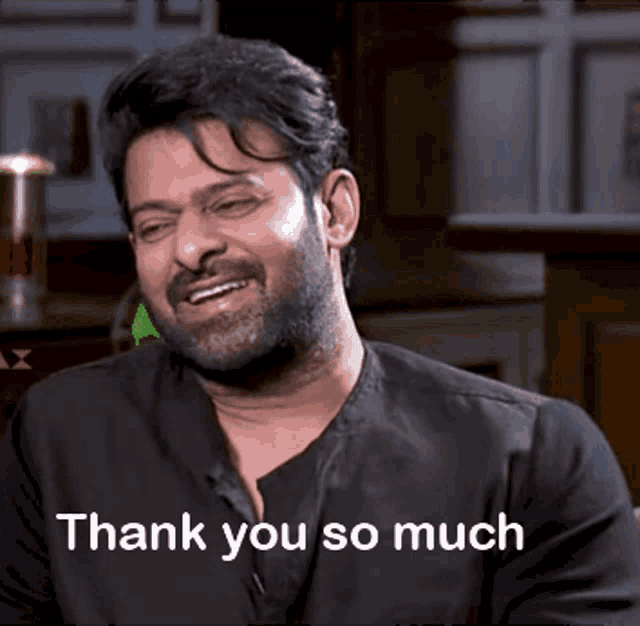 a man with a beard is smiling with the words thank you so much below him