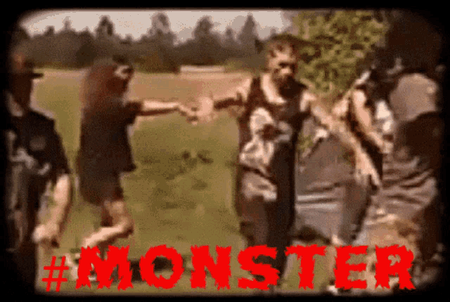 a group of zombies holding hands in a field with the word monster in red