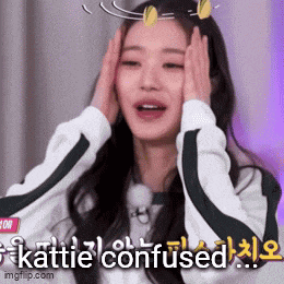a woman is covering her face with her hands and the words katie confused are written on the bottom .