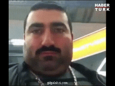 a close up of a man 's face with the words haber turk on the bottom left