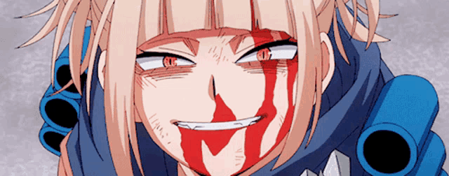 a close up of a girl with blood on her face and mouth