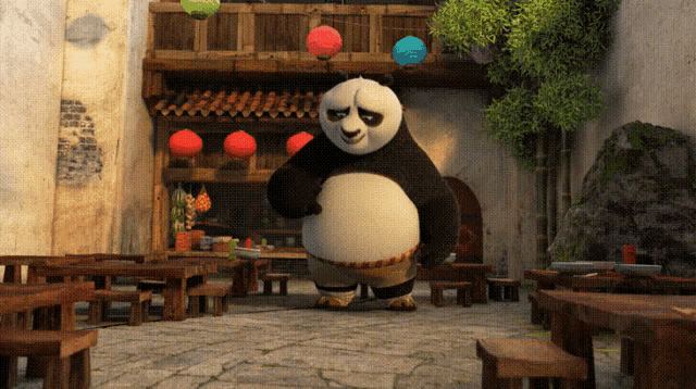 a panda bear is standing in front of a building