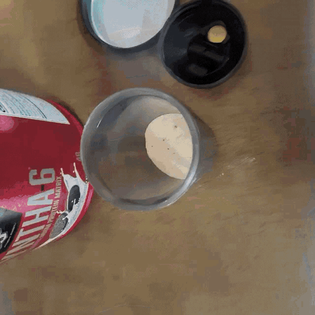 a stainless steel container with water pouring out of the top