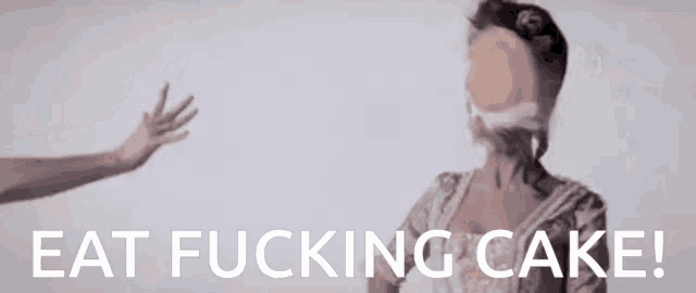 a woman 's face is covered in cake and the words eat fucking cake are on the bottom