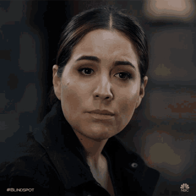 a close up of a woman 's face with the hashtag blindspot on the bottom